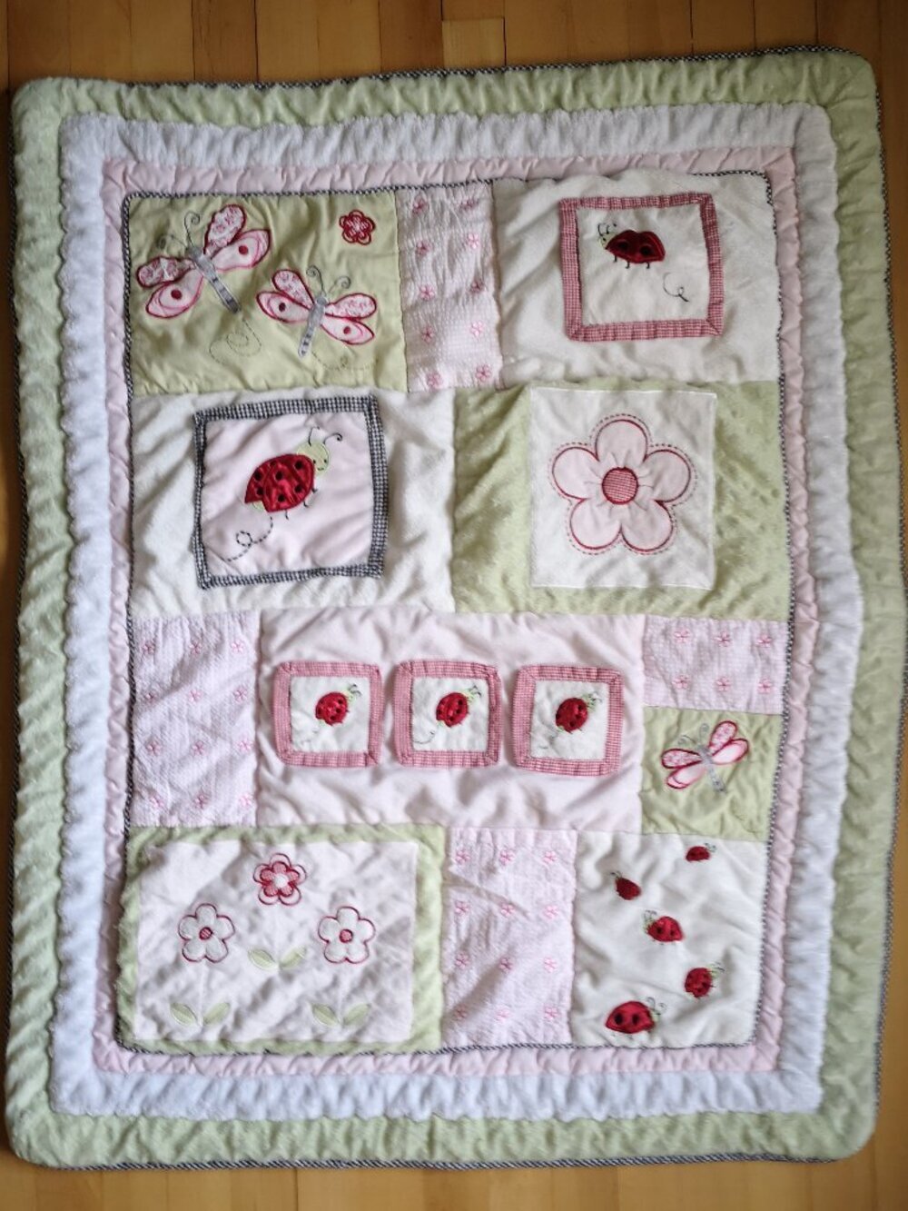 Small Quilt featuring a Patchwork Design w/ Lady bugs, Butterflies, & Floral